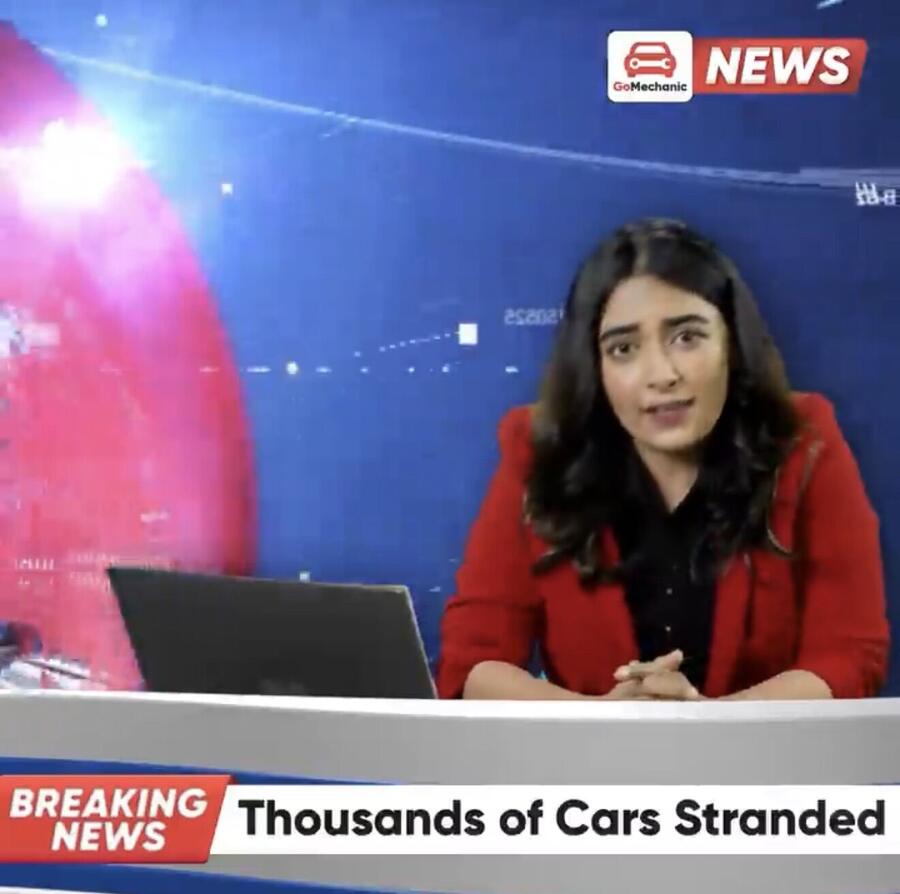 Jinal as a TV news anchor in a GoMechanic ad