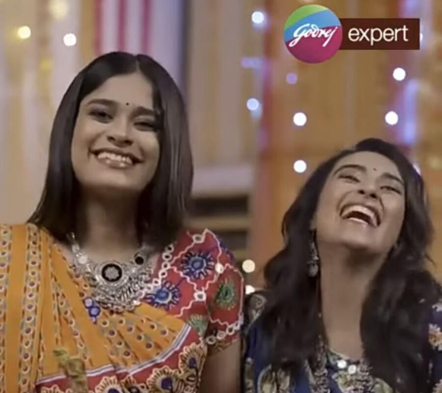 Jinal laughing with a co-star in a Godrej Expert Rich Crème ad