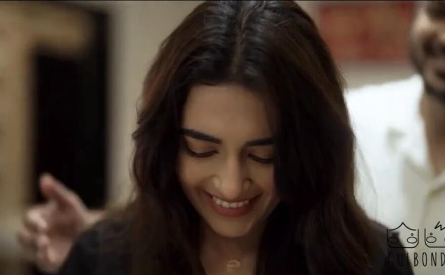 Jinal smiling, eyes lowered, in a Gulbonda film
